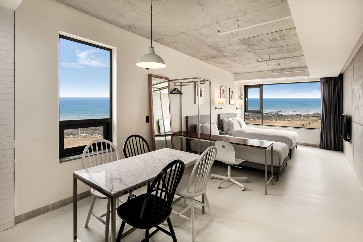 twin | living area | 49-inch flat-screen tv with cable channels, tv, heated floors