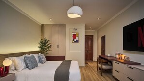 Family Quadruple Room, City View | Premium bedding, down duvets, minibar, desk - Maison Truong Thinh Hotel by Urban B (Ho Chi Minh City)