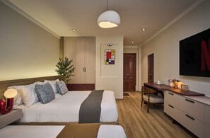 Family Quadruple Room, City View | Premium bedding, down duvets, minibar, desk - Truong Thinh Hotel (Ho Chi Minh City)