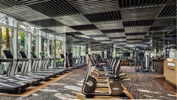 A gym with treadmills, stationary bikes, and weight machines. - Prince Desert Camp (Jaisalmer)