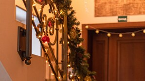 A staircase with decorative lights and a small Santa Claus figure. - Ekaterinoslav (Dnipro)