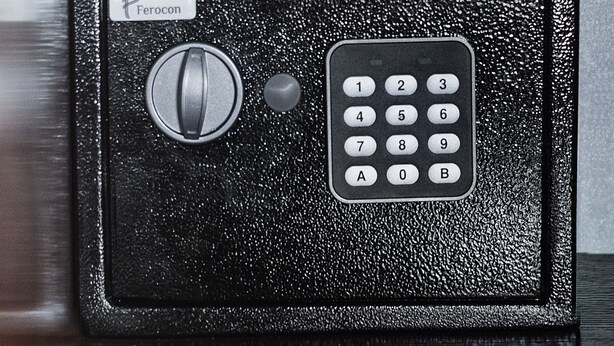 A black safe with a numeric keypad and a keyhole, labeled "Ferrocon." - Ekaterinoslav (Dnipro)