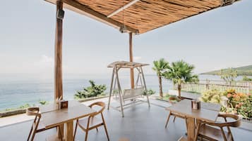 Breakfast, lunch, dinner served; beach views