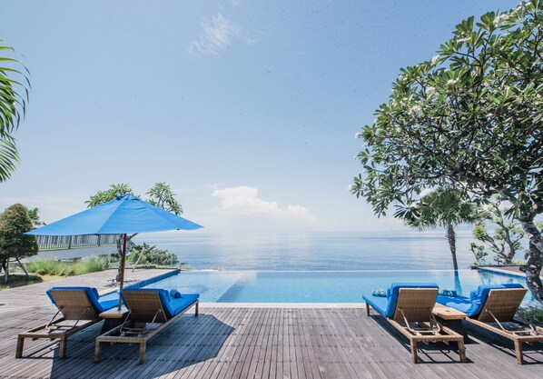 Outdoor pool, open 6:00 AM to 8:00 PM, pool loungers