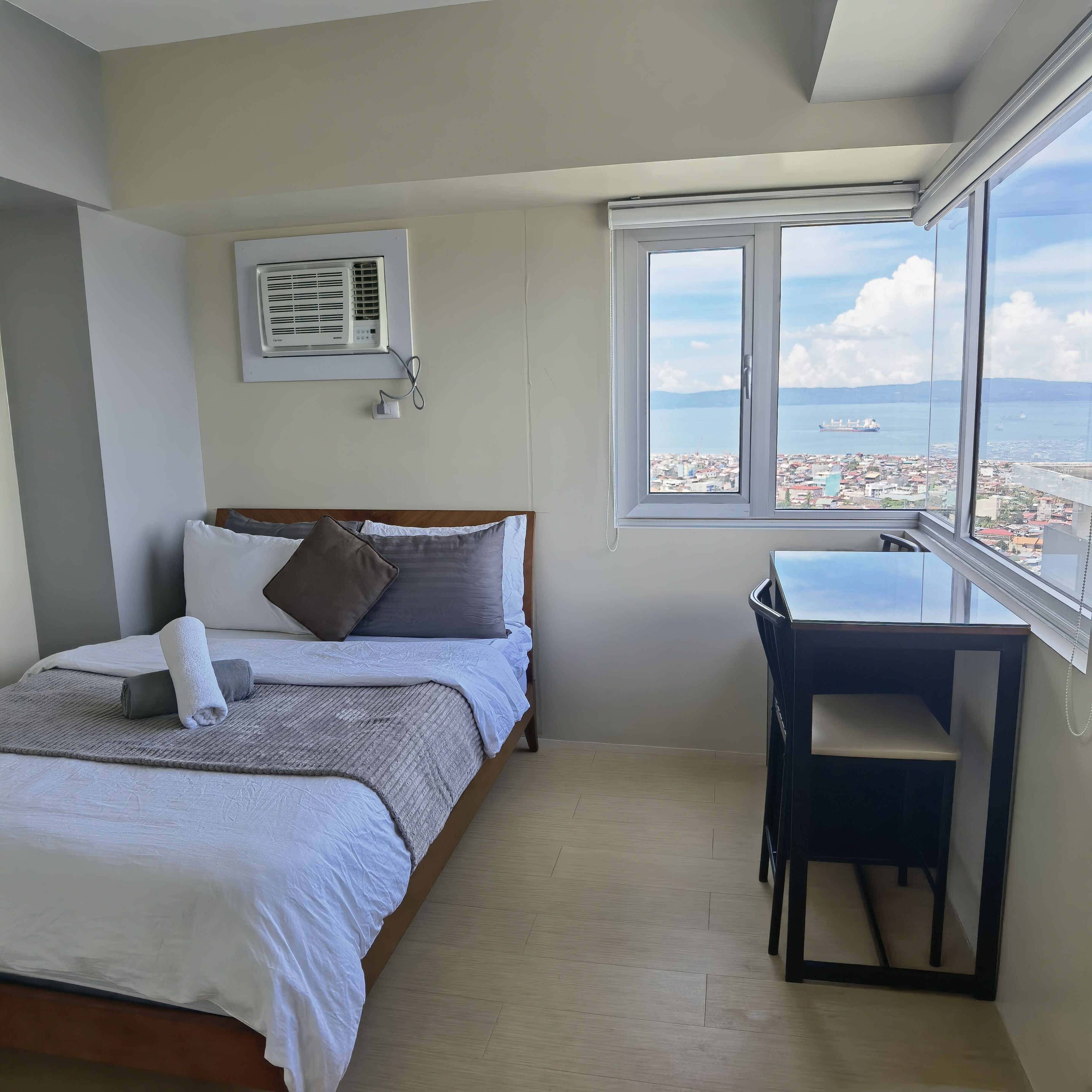 Panoramic Penthouse | Premium bedding, desk, laptop workspace, blackout curtains