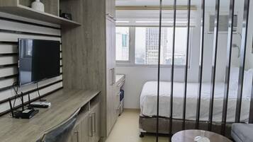 Premium bedding, desk, laptop workspace, blackout curtains