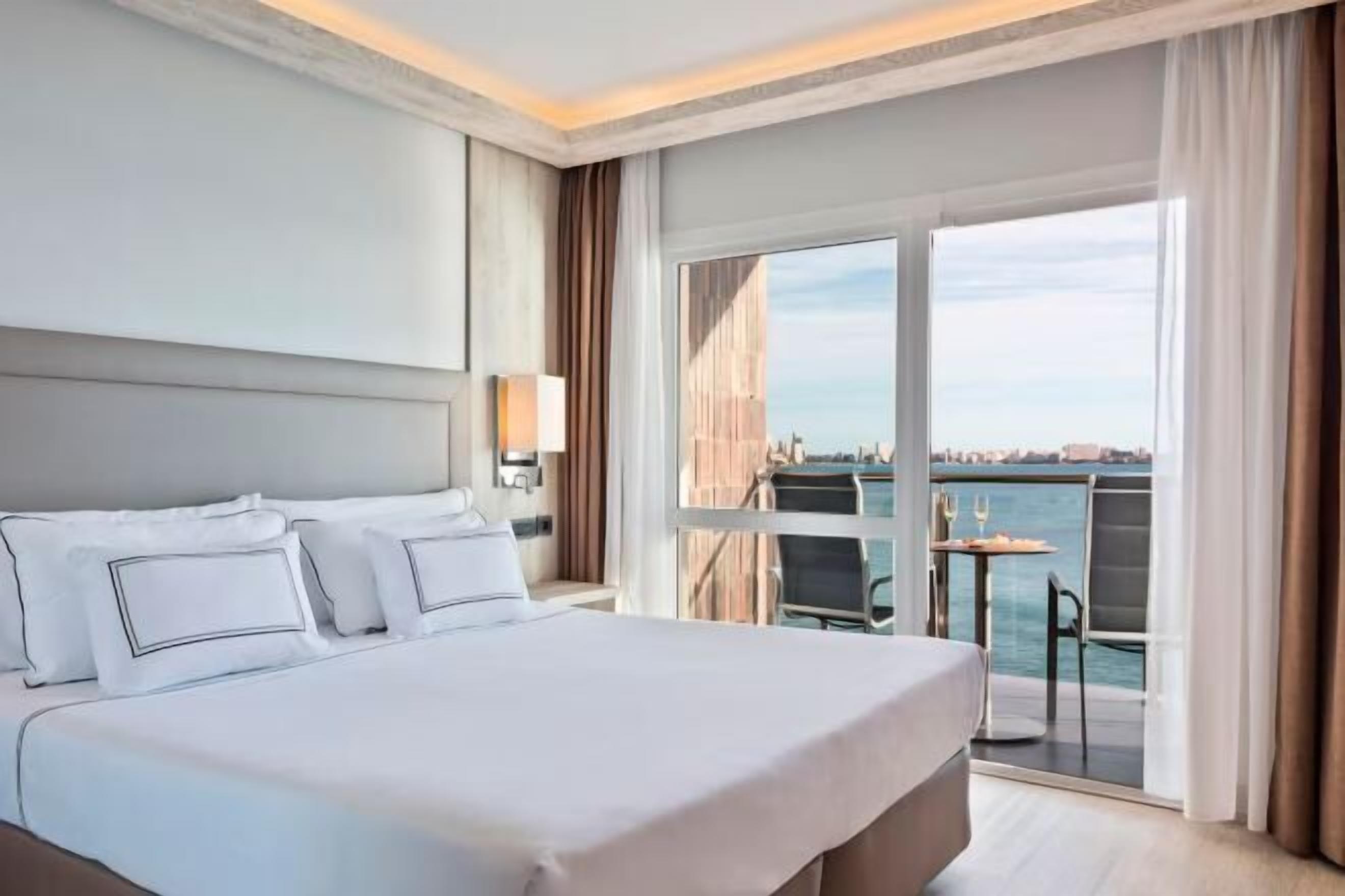 Egyptian cotton sheets, premium bedding, minibar, in-room safe