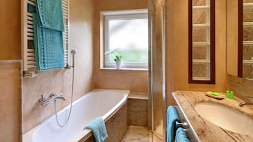 Superior Apartment, 1 Bedroom, Balcony | Bathroom | Deep-soaking bathtub, free toiletries, hair dryer, towels