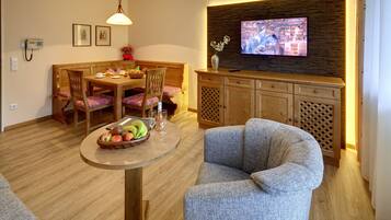 Superior Apartment, 1 Bedroom, Balcony | Living area | Flat-screen TV