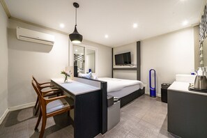 Premium Double Room, Non Smoking | Living area | 50-inch flat-screen TV with cable channels, TV, Netflix