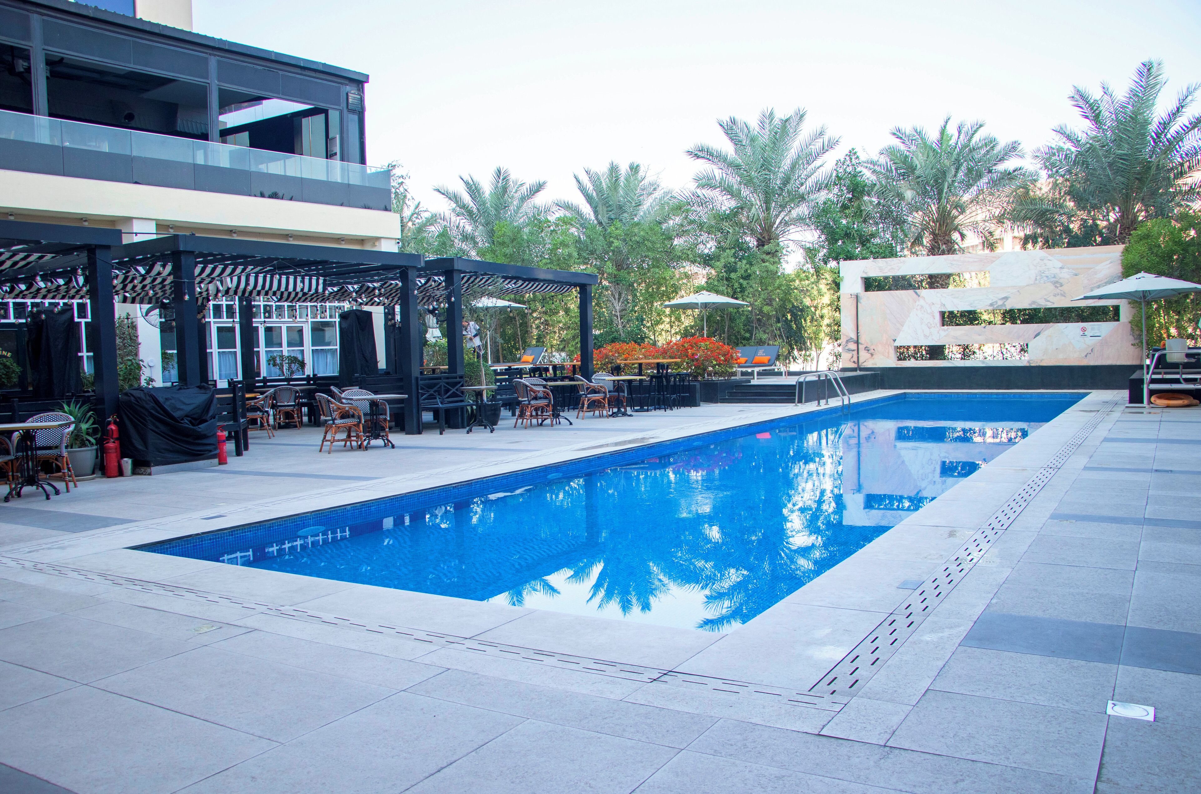 Outdoor pool, open 7:00 AM to 6:00 PM, pool umbrellas, sun loungers