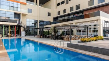 Outdoor pool, open 7:00 AM to 6:00 PM, pool umbrellas, pool loungers