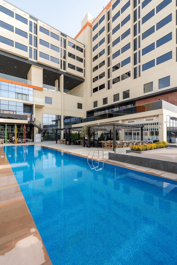 Outdoor pool, open 7:00 AM to 6:00 PM, pool umbrellas, pool loungers