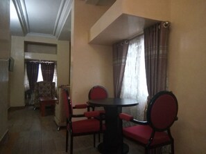 Grand Room, 1 King Bed, Non Smoking, Pool View | Living area | 32-inch flat-screen TV with cable channels, TV - Top Rank Hotel Galaxy Enugu (Enugu)