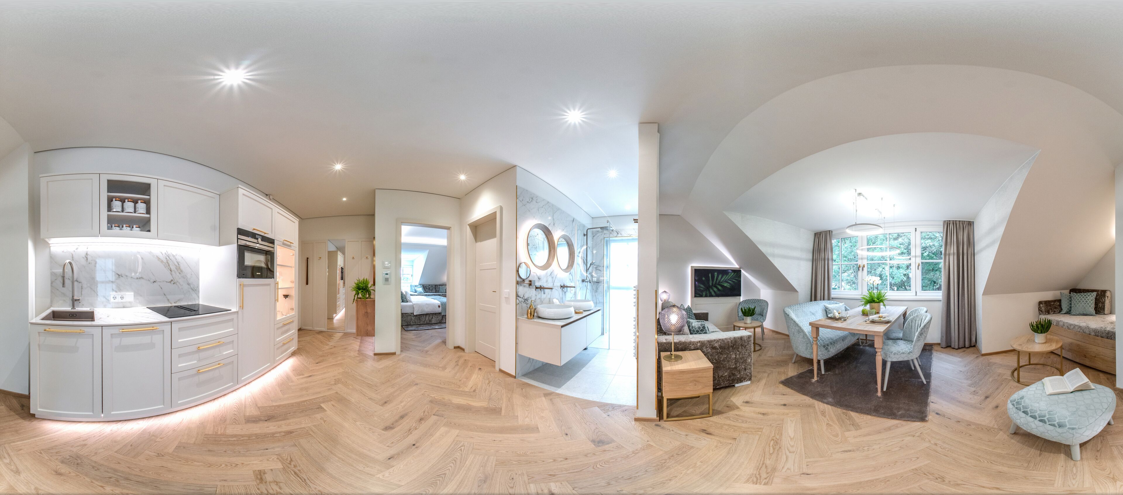 Ein modernes Interieur mit Küche, Essbereich und Schlafzimmer.