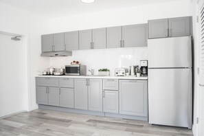 Full-sized fridge, microwave, stovetop, dishwasher