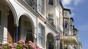 A multi-story building with a sign reading "RED LEA HOTEL" on the facade. - Red Lea Apartments (Scarborough)