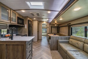 Premium Campers for Families and Included Adventure Activities | Living area