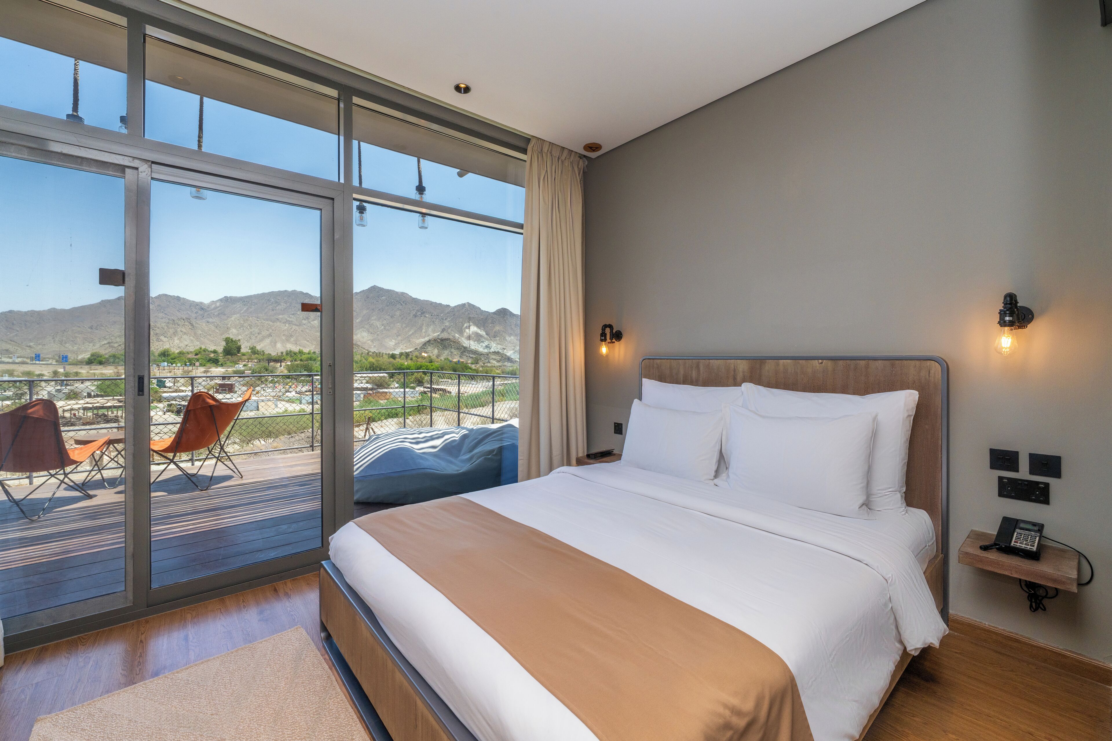 Deluxe Lodge with Mountain Backdrop and Complimentary Adventure Activities | Minibar, blackout drapes, iron/ironing board, free WiFi