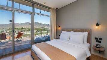 Deluxe Lodge with Mountain Backdrop and Complimentary Adventure Activities | Minibar, blackout curtains, iron/ironing board, free WiFi