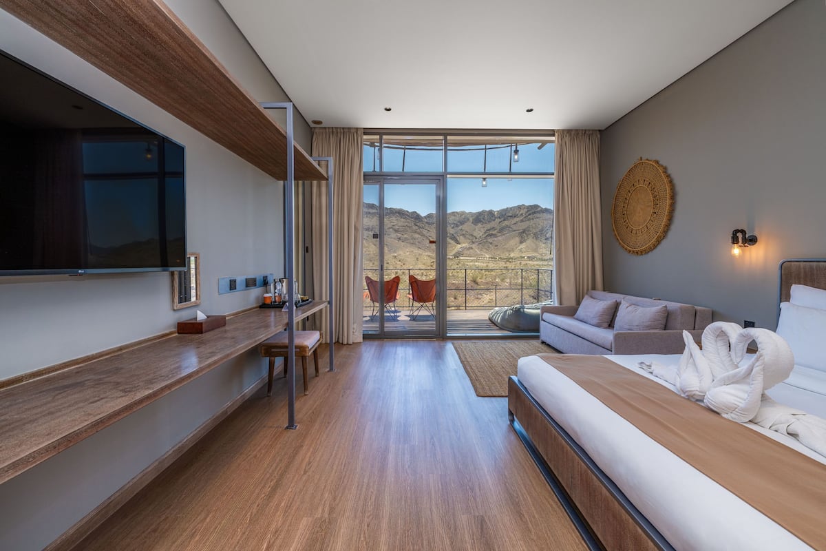 Premium Lodge with Scenic Mountain Views & Access to Adventure Activities | Minibar, blackout drapes, iron/ironing board (on request), WiFi (free)