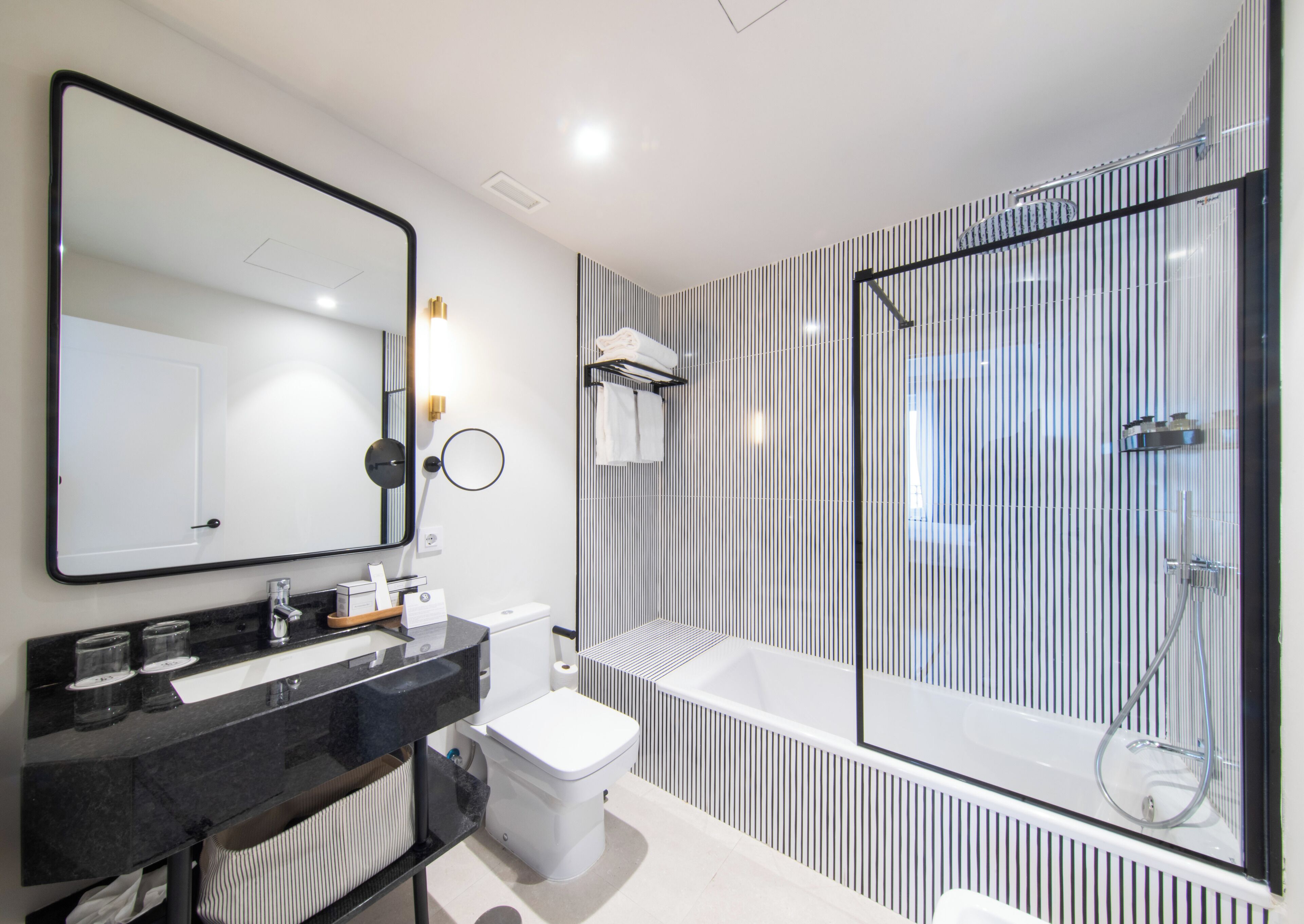 hair dryer, towels, shampoo, toilet paper