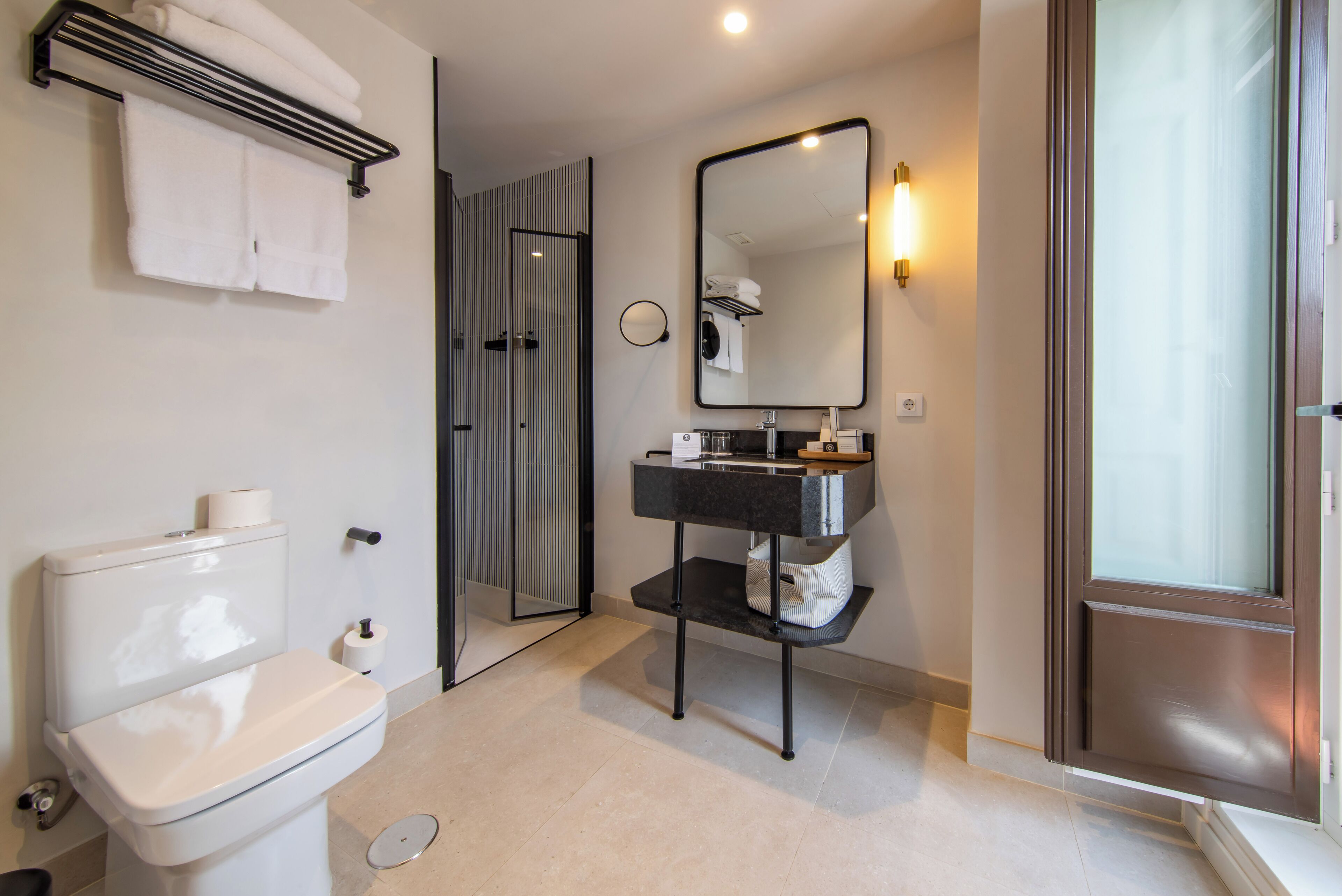 hair dryer, towels, shampoo, toilet paper