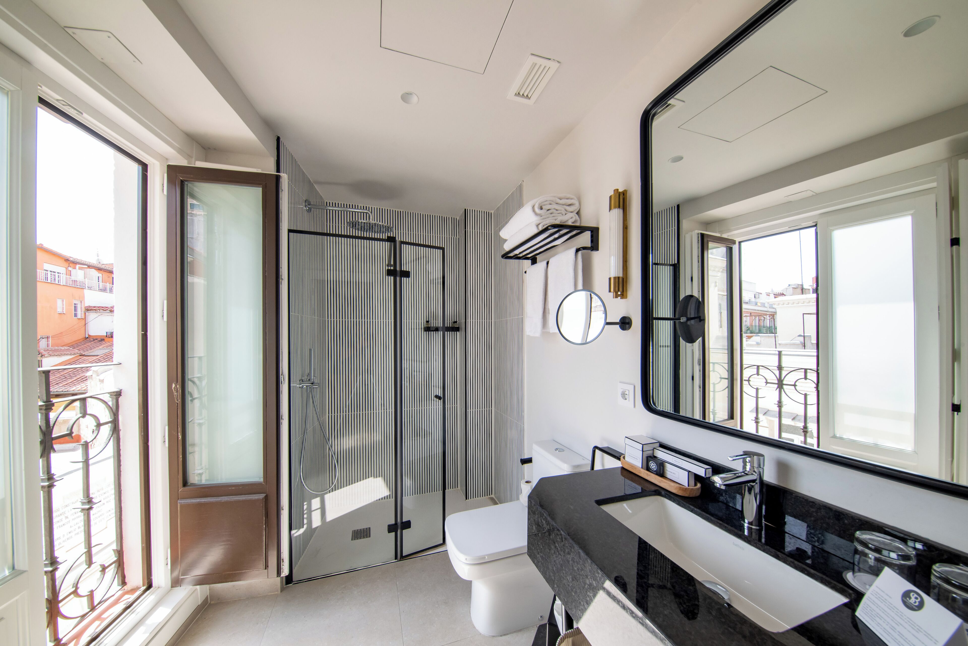 hair dryer, towels, shampoo, toilet paper