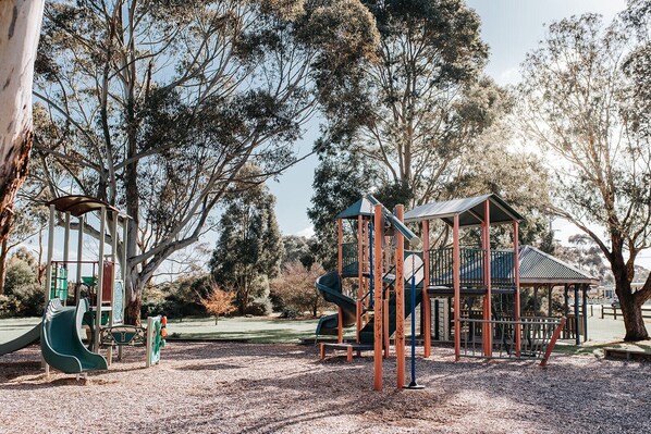A playground with a slide, climbing structures, and a gazebo. - 360o views incl. The Prom, Bass Strait and Strzelecki Ranges (Hazel Park)