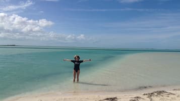 On the beach, sun loungers, beach towels