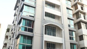 A multi-story hotel with a sign indicating it is the Platinum Hotel Ltd. The building has a modern architectural style with large windows and balconies. - Platinum Hotel Ltd (Dhaka)