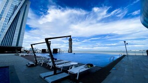 Seasonal outdoor pool, open 7:00 AM to 10:00 PM, sun loungers