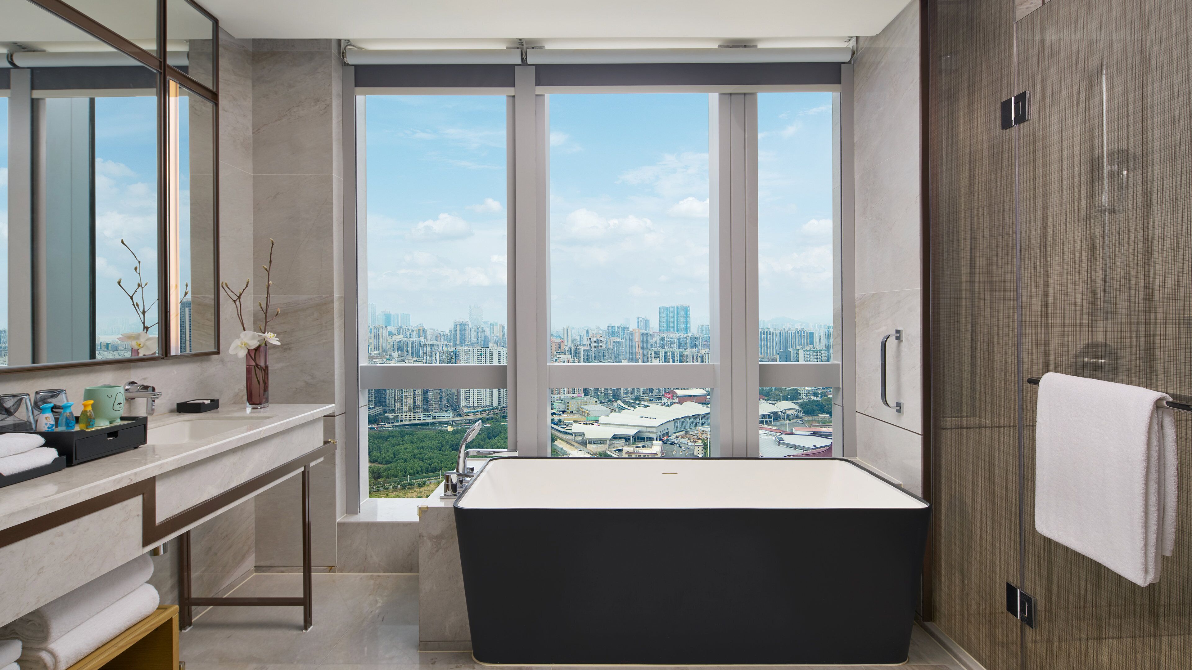 separate bathtub and shower, slippers, towels