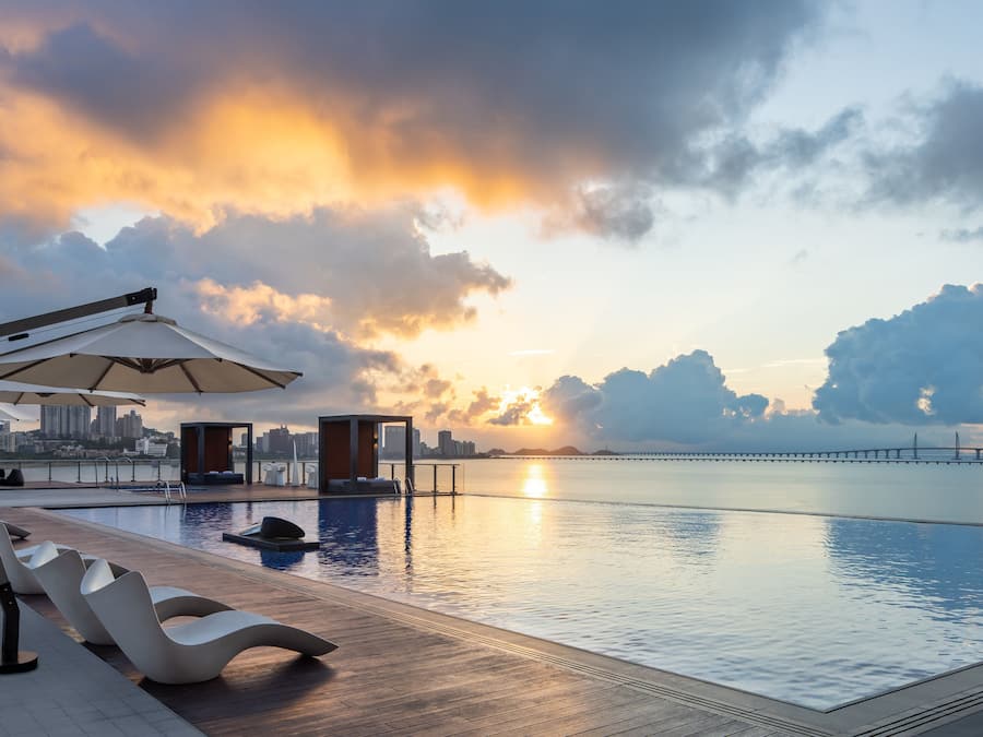 Seasonal outdoor pool, open 7:00 AM to 10:00 PM, pool loungers