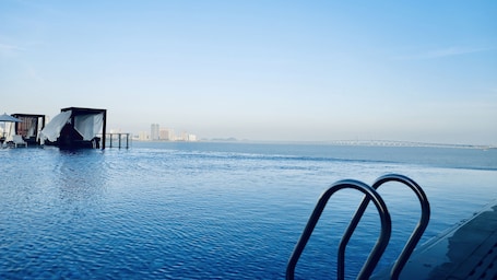 Seasonal outdoor pool, open 7:00 AM to 10:00 PM, sun loungers