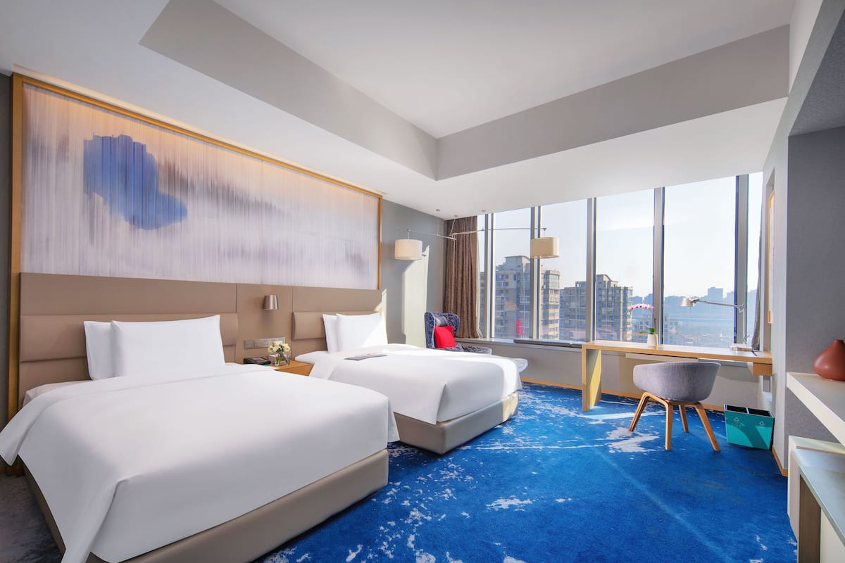 club room, 2 double beds, city view | minibar, in-room safe, desk, laptop workspace