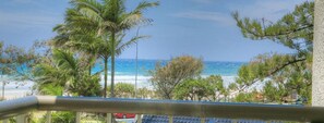 A balcony with a view of the beach and ocean. - Kupari Apartments (Surfers Paradise)