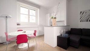 A modern living space with a dining area, kitchen, and seating area. - Luxury appartment in Montenapoleone (120 sqm) with parking in the building (Milano)