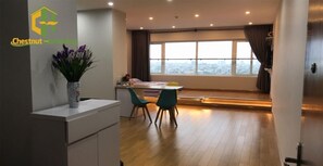 23-inch flat-screen TV with cable channels, TV - Chestnut Homestay (Ho Chi Minh City)