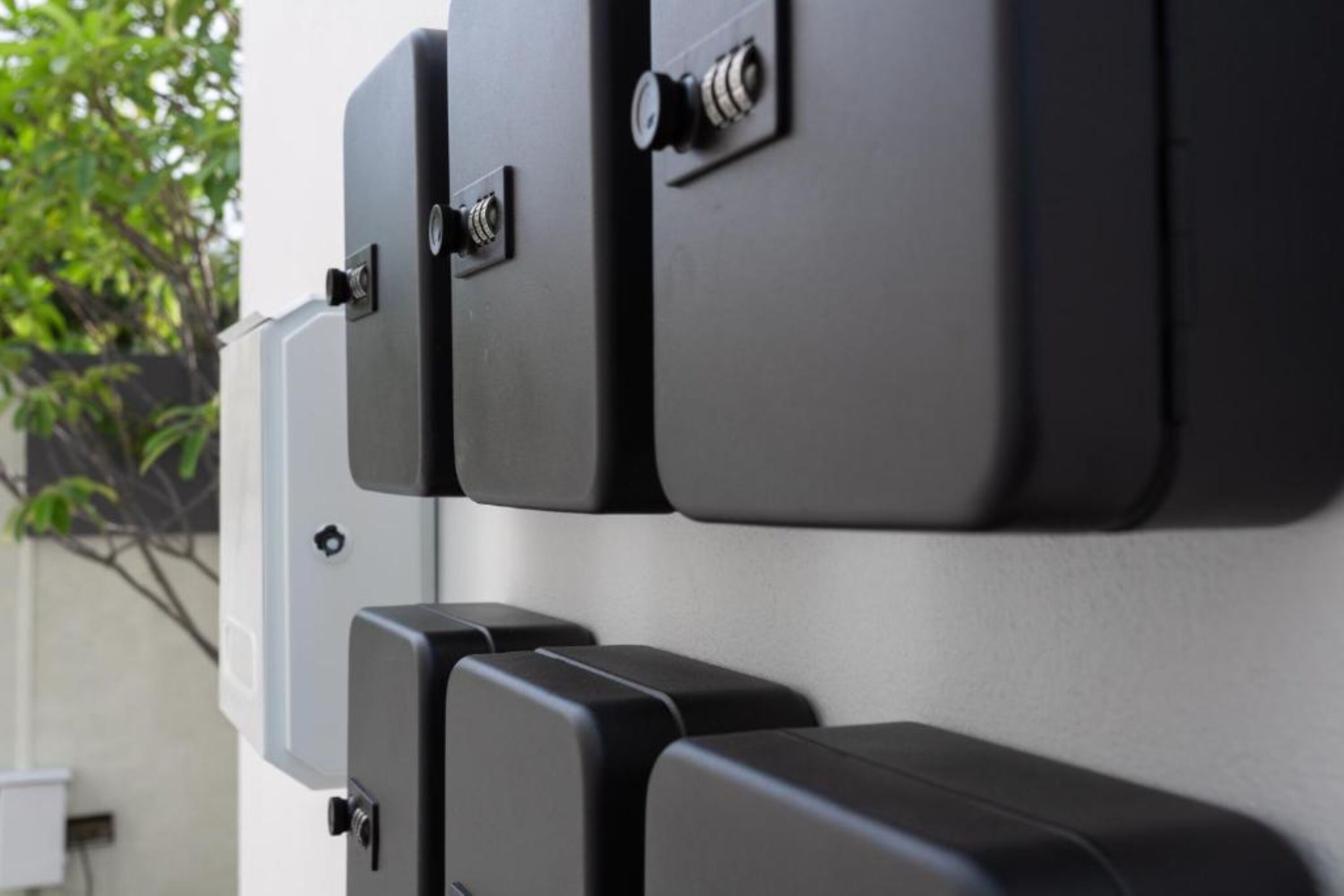 A wall-mounted electrical panel with multiple switches and sockets.