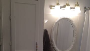 Combined shower/bathtub, towels, soap, toilet paper