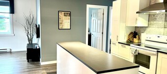 SUTTON- Condo Au coeur du village! Lieux de villégiature