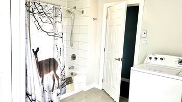 Combined shower/bathtub, hair dryer, towels, soap