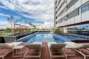 Outdoor pool, pool umbrellas, sun loungers