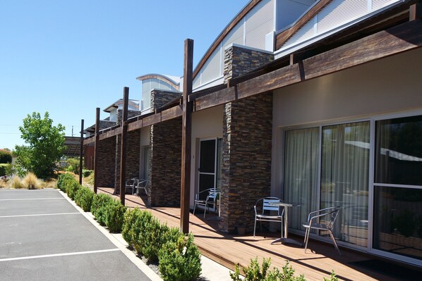 A modern building with a covered outdoor seating area and large windows. - A Must At Coonawarra (Penola)
