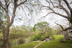 Backyard of home leading to the Guadalupe River