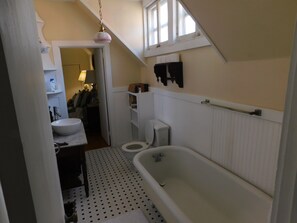 Bathtub, hair dryer, towels, soap
