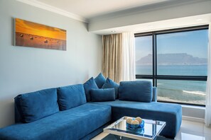 Sea Facing One Bedroom Suite | Living area | Flat-screen TV