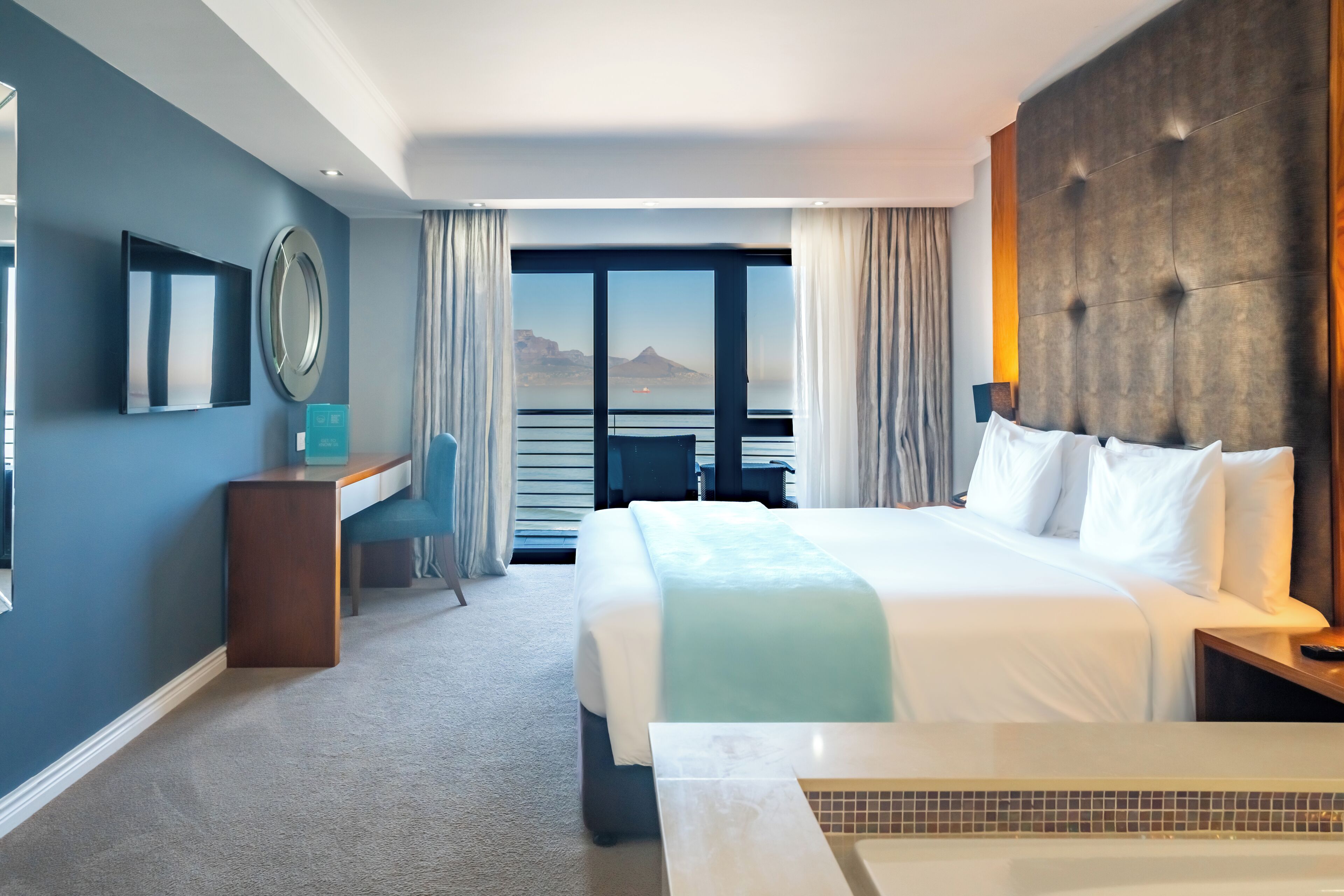 sea facing table mountain king room with balcony | premium bedding, minibar, in-room safe, individually decorated