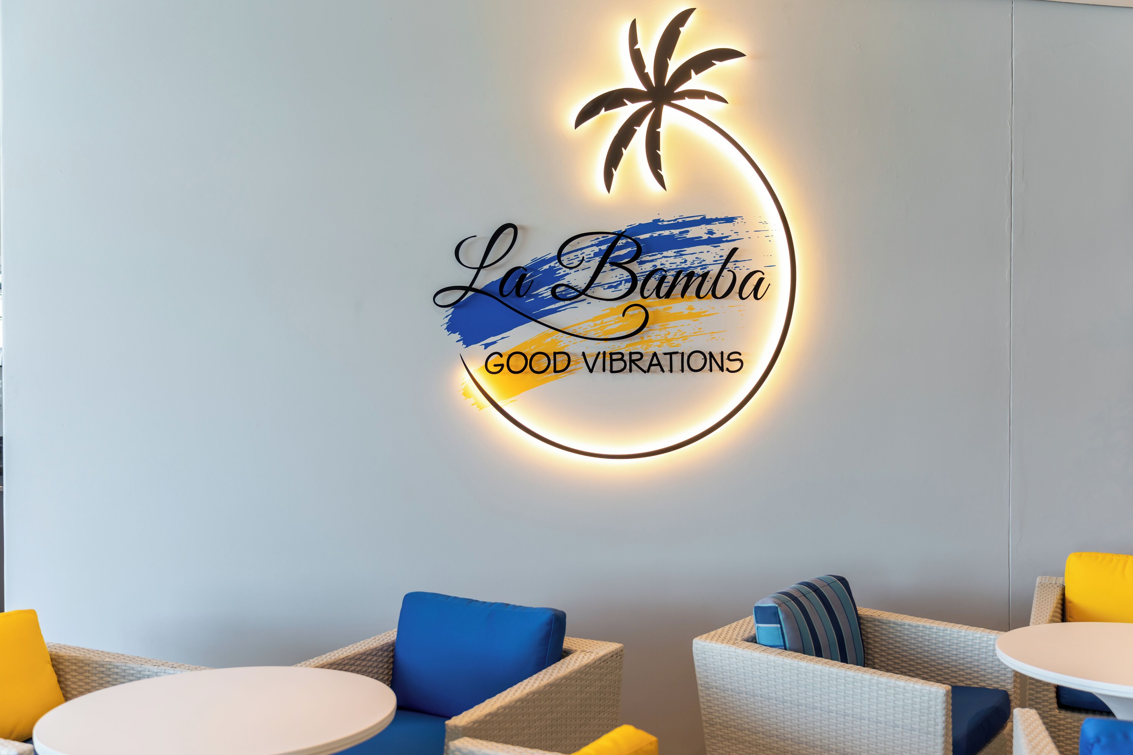 A wall with a logo for "La Bamba" and the phrase "GOOD VIBRATIONS".